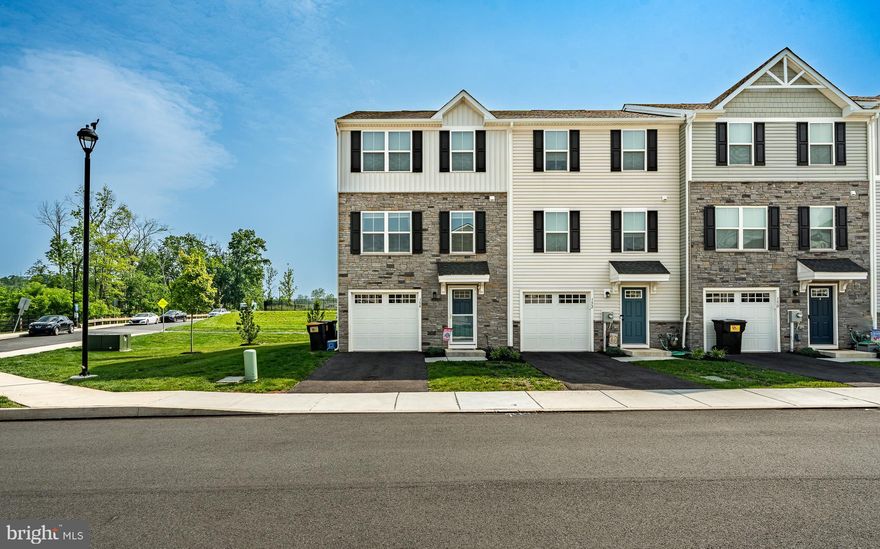 Welcome Home to 154 Nelson Lane!
Discover your dream home at 154 Nelson Lane, a stylish end-unit townhouse built in 2022 and nestled in the desirable Sanatoga Crossing Community. This modern and convenient location is just minutes from Route 422, offering easy access to everything you need. What's more, you'll find yourself extremely conveniently located near Costco and the Philadelphia Premium Outlets, making shopping and errands a breeze!

This home boasts a prime lot, offering more desirable space than many other homes in the community. Step inside and be greeted by a versatile lower level, complete with modern flooring, ideal for a home office, den, or workout room. This level also provides direct access to your backyard and a spacious storage closet, keeping everything organized.

The heart of the home is the open-concept main floor, brimming with natural light. The updated kitchen features sleek appliances and an adorable nook, perfect for savoring your morning coffee. But the true highlight is the expansive rear deck, which is likely the largest in the neighborhood, offering breathtaking sunset views. It's the ideal spot for summer BBQs, cozy fire pit gatherings, or tranquil evenings under string lights.

Upstairs, you'll find three comfortable bedrooms, two full bathrooms, and a convenient laundry area. Plus, with a one-car garage, you'll have ample parking and storage. This home truly radiates good vibes from the moment you enter. Come experience the perfect blend of style, space, and sunshine at 154 Nelson Lane!