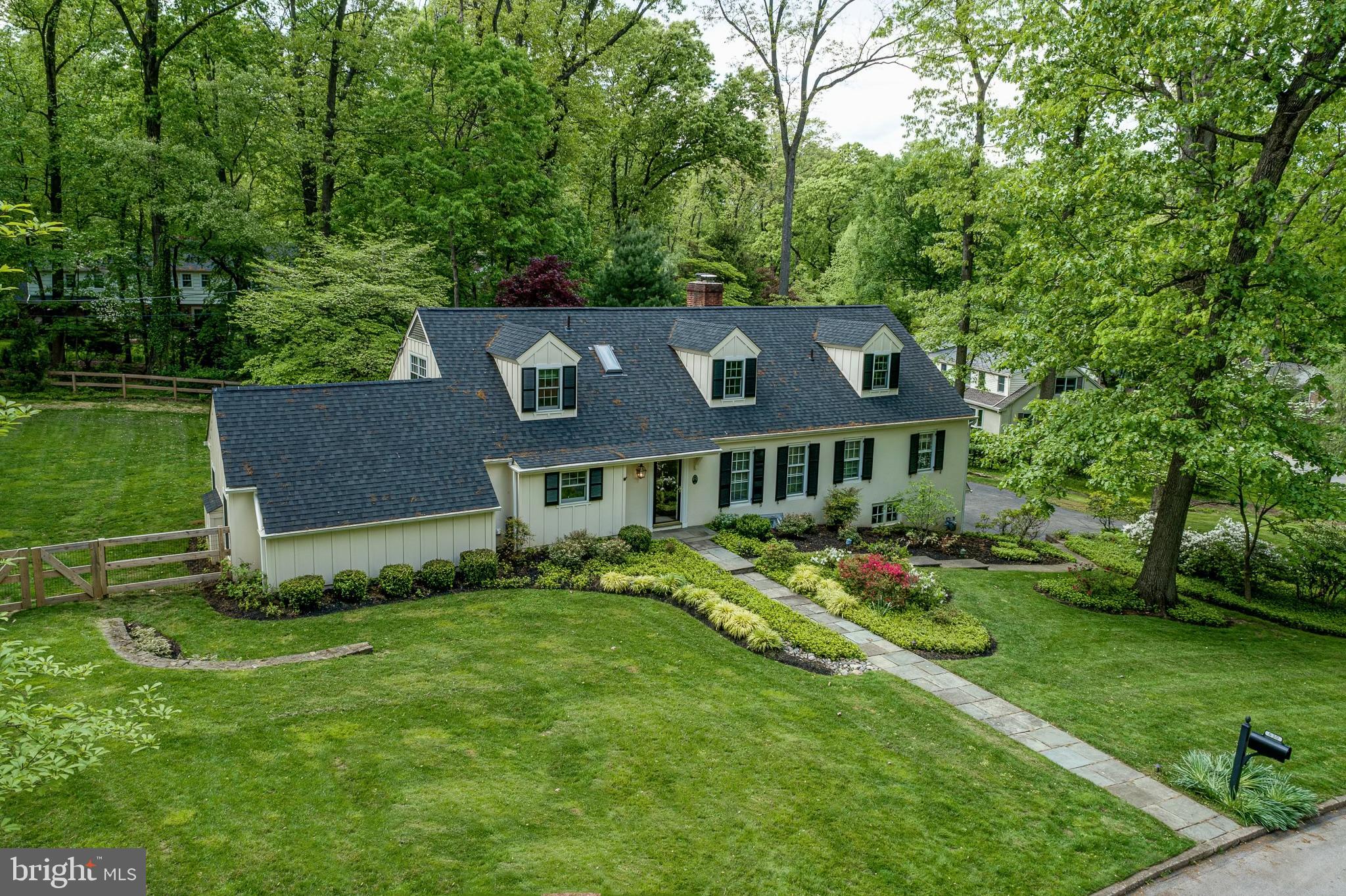 Stunning renovated colonial set on a quiet tree lined street in the sought after Shand Tract neighborhood! This Architect owned home has been meticulously designed, thoughtfully, purposefully and tastefully renovated to accommodate today's lifestyle and completed to the standards of the most discerning buyer. Enter this home and you are immediately drawn into the show stopping chef’s kitchen which is open to the light filled great room. From the handmade custom cabinetry, under cabinet lighting, granite counters, full slab backsplash, to the Thermador Professional series appliances, a six burner natural gas cooktop and dual sinks, it is not only beautiful but cooking in this kitchen is a dream. A large granite topped center island seats four with beverage refrigerator, a beverage sink (or prep sink) and the radiant heated floors make it a delight to entertain! There is an abundance of storage both in the island and the wall of custom cabinetry. The Great room features architectural beams in the vaulted ceiling, a floor to ceiling stacked fieldstone gas fireplace and a wall of windows offering the perfect vantage point of the gardens and opens to the back patio perfect for indoor/outdoor entertaining or al fresco dining. The formal Dining room is spacious and the bay window allows for sunlight to stream in. The living room is a substantial space that can accommodate a seating area around the wood burning fireplace with custom built-ins for books and storage and an additional sitting area with new sliding doors opening to the patio. The Oversized first floor Primary Suite features a large custom outfitted walk-in closet and a bathroom worthy of any spa! A whirlpool soaking tub, steam shower, heated floors, double vanity and designer tile with custom mosaic inlay make it the perfect retreat. A cozy guest suite with walk-in shower and designer tile surround and the powder room complete the first floor. Upstairs find a central sitting/reading area and 3 spacious bedrooms all with custom outfitted closets, one an ensuite and beautifully renovated baths. The Bedrooms on either end are Oversized and feature dormers for full height ceilings, one an ensuite has a bath with designer tile, river rock shower floor and large walk in closet. The additional 2 bedrooms share the renovated hall bath with soaking tub and double pedestal sink. The walkout daylight lower level is a true extension of the home. Convenient garage access opens into a mudroom with cubbies and bench and a powder room & laundry room. The spacious Family Room has a granite topped kitchenette, and there is a 6th bedroom/office with a large closet and its own sliding glass door entrance, perfect for an inlaw suite, office or au pair. Outside the flagstone patio overlooks a large private fenced in yard and gardens with room for a pool! All of this beautiful space is backed up by the best systems - 2 Zone Geothermal cooling & heating for low energy bills, a whole house generator for peace of mind, Radiant Heated floors in Kitchen/FamRm & Master Bath, new fencing, surround sound, newer windows and roof, all that is left is for you to move in and enjoy! All of this in the highly desirable Shand Tract in Devon known for its neighborhood parades, activities and parties! Located in the award winning Tredyffrin-Easttown school district and in close proximity to top ranked private schools, wonderful shopping, dining and all that the Main Line has to offer. Enjoy easy access to the Amtrak trains and major highways allowing an easy commute to Philadelphia Int’l Airport, Center City or NYC. Make your appointment today- You will not be disappointed!
