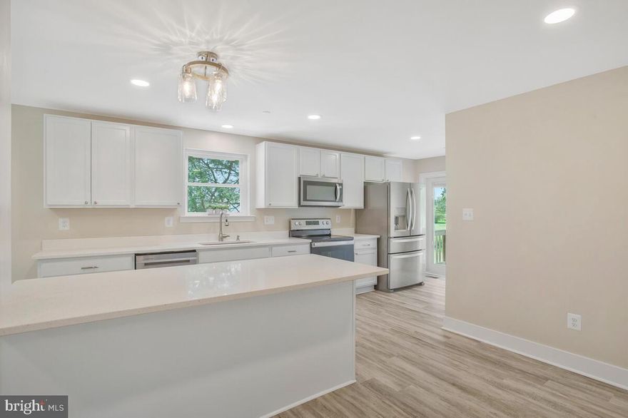 Beautifully remodeled home on 1.4 acres.  Open concept floorplan with 3 Bedrooms & 3.5 Baths.  Yes, all Bedrooms have their own Full Bathroom! Main level Owner's Suite with recessed lighting & ceiling fan, walk-in closet & full bath w/double vanity & tiled shower. Gorgeous Kitchen with large quartz island, upgraded stainless appliance pkg, quartz countertops, shaker style cabinets & walk-in pantry.  A spacious  Dining Area, Living/Family Room with Fireplace,  Half Bath, Office/Flex Room, separate Laundry Rm and additional walk-in closet at rear foyer finish out the main level. The  upper level has 2 additional Bedrooms, both with their own bathrooms & walk-in closets.   Recessed lighting throughout, solid interior doors, double hung windows, tall baseboards.  All new mechanicals, well, septic tank, HVAC, plumbing & electrical, fire sprinkler system, roof, gutters, windows & more.  Lots of storage area throughout and in basement.  Enjoy the  Peace of this Beautiful lot from your front porch while sipping your favorite beverage.  Feels like your far away from the hustle & bustle but really close to major routes to commute to Wash DC, AAFB, PAX River, N VA, Dining & Entertainment, Parks & Recreation.  Make sure to click on the movie camera icon to view the Virtual Tour!