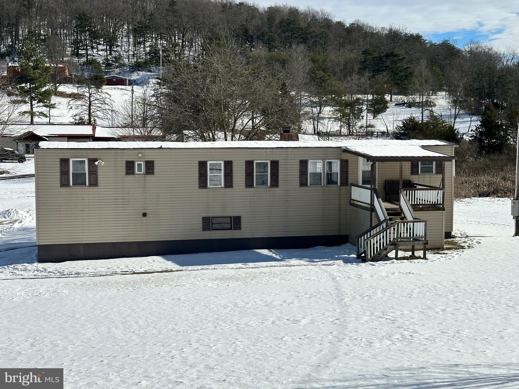 “Don’t Judge a book by its Cover”
New Creek Fully Furnished 3 Bdrm, 3 Bath 2 sty. Mobile Home on 1.2 acres with full perimeter foundation. Fully equip. Eat-In Kitchen w/ brkfast bar. Spacious Liv. Rm. Upgraded Wd. Flrs on Main flr. Master Bdrm w/ private full bath. Full walk-out Bsmt inclds Huge Family Rm., Full Bath, tons of storage and a nice workshop! Covered front and rear porch. Direct road frontage on Co. Rd. Unrestricted Property only $129,500!
*Deeded ROW* for ingress and egress to the property in the rear. SELLER REBATE - $2,500