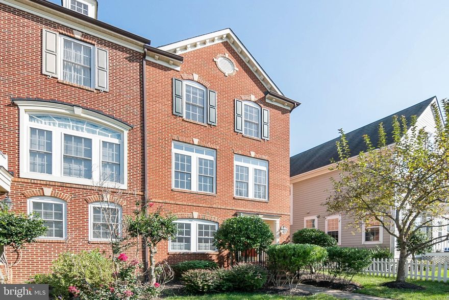 This lovely brick front end unit townhome is situated in a great Villages of Urbana location!  With loads of windows, this home features light-filled spaces, gleaming hardwoods on the main level and an open floorplan--great for entertaining!  On the main level, the eat-in kitchen with breakfast bar and stainless steel appliances opens to a large deck. The spacious family room features freshly painted gray walls and a convenient main level powder room. On the upper level, the Owner's Suite boasts two walk-in closets, a cozy sitting area and a spa bath. Plus, two more upper bedrooms and a hall full bath.  On the lower level,  you will find a spacious recreation area, full bath and a bonus room--perfect for a guest bedroom, office or craft room! Walk out to the covered patio and fenced large deck leading to the two-car garage. Situated in a great location--walk to the resort-style pool and clubhouse with work-out facility. Close to schools, playgrounds and great Urbana amenities!