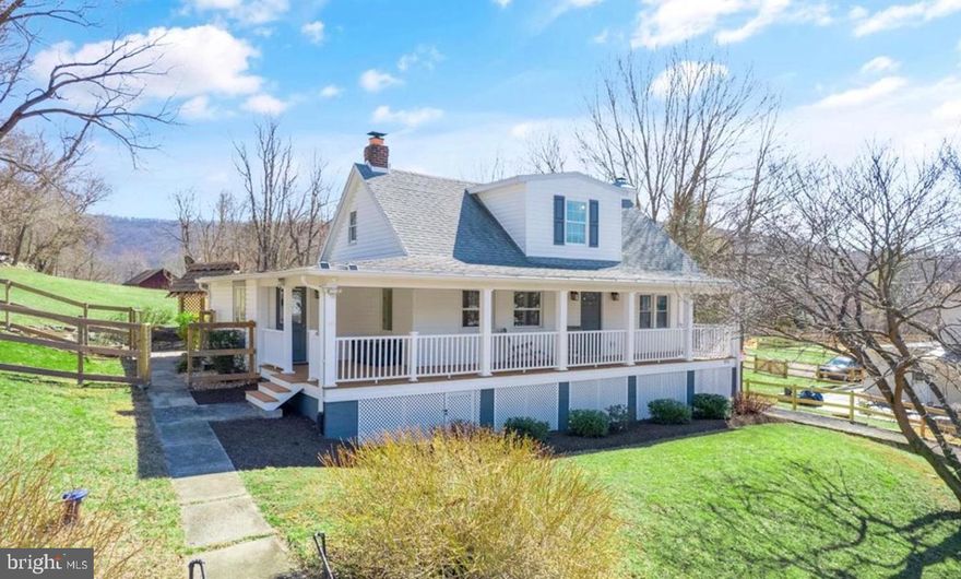Nestled near historic Hillsboro, VA, this charming Cape Cod, originally built in 1890, has been thoughtfully expanded and updated over the years. The most significant transformation occurred between 2008 and 2012, when the home underwent a comprehensive renovation, including the addition of two upper-level bedrooms and a full bath. During this time, all major systems—well, septic, and more—were replaced or upgraded.

The main level showcases beautiful hardwood floors and features a modernized kitchen, a cozy living room, a dining room, and a primary bedroom with an en-suite bath. The unfinished basement offers abundant storage and is highlighted by a gorgeous stone fireplace—just waiting to become the focal point of a future finished space.

Outside, the nearly one-acre lot—with no HOA—provides ample room to enjoy the peaceful countryside and stunning mountain views. A charming chicken coop is ready for new feathered friends, while the back deck, patio, and grill area create the perfect setting for outdoor gatherings. The large wraparound front porch is an inviting spot to sip your morning coffee or unwind after a long day.

Additional features include a spacious shed, a detached one-car garage, plenty of parking, and extra storage space beneath the house.

Ideally located near Harpers Ferry, WV, and the popular wineries, breweries, parks, and hiking trails of northern Loudoun County, this home is a haven for outdoor enthusiasts. Whether you’re looking for a full-time residence or an exceptional short-term rental opportunity, this property is ready to welcome you.