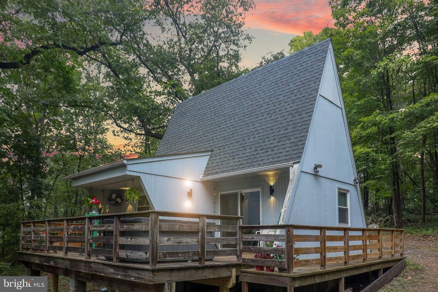 Escape to the mountains in this storybook A-frame cabin, nestled on a wooded one-acre lot with deeded access to the river. Whether you’re looking for a personal getaway or an income-producing property, this gem is move-in ready and full of charm.
Step outside and take in nature from the wraparound deck, unwind in the private hot tub, or cozy up inside after a day of adventure. Recent updates—HVAC, new flooring, and fresh interior and exterior paint—make this home as comfortable as it is inviting.
Currently operating as a permitted Airbnb, the property offers excellent short-term rental potential, or it can easily become your new vacation retreat. Just bring your bags and start making memories—kayaking, fishing, hiking, or simply relaxing under the trees.