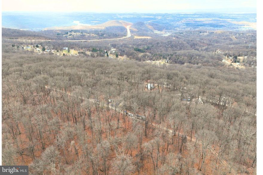 Enjoy mountain views from this elevated half acre lot at the top of the ridge on Hickory Nut Lane in Harpers Ferry, WV. This wooded parcel offers a private, scenic setting ideal for a future cabin, weekend getaway, or custom home. Located in a quiet, rural neighborhood with existing homes, the property offers potential for residential or recreational use. Gently to moderately sloped terrain provides natural character and privacy. Road frontage allows for straightforward access, and utilities appear available in the area based on nearby homes. Conveniently located near the Potomac River, Appalachian Trail, and just a short drive to downtown Harpers Ferry, shops, and commuter routes. A rare chance to own mountain-top land where West Virginia and Virginia meet!