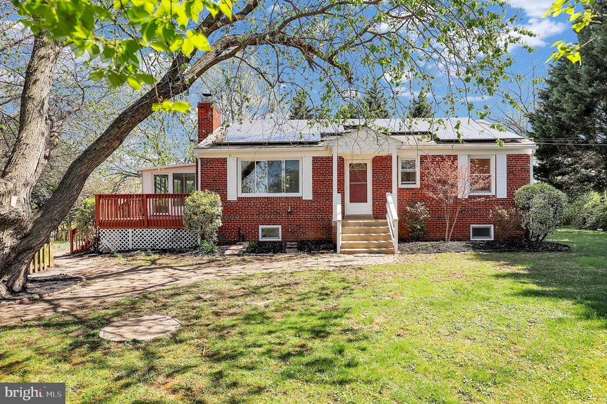 Charming brick rancher thoughtfully updated with modern finishes throughout. Enjoy cooking in the renovated kitchen featuring new stainless steel appliances, sleek new cabinets, and recessed lighting. Freshly painted interior and wood flooring create a bright, inviting feel. Renovated bathrooms add a touch of luxury, while a unique spiral staircase leads to a versatile lower level with a second kitchen, full bath, and private bedroom—ideal for guests or extended living. A sunroom offers year-round enjoyment and views of the spacious lot, perfect for outdoor gatherings. Ideally located near top-rated Montgomery County restaurants, shopping, and just minutes from Route 29, this home blends comfort, style, and convenience.