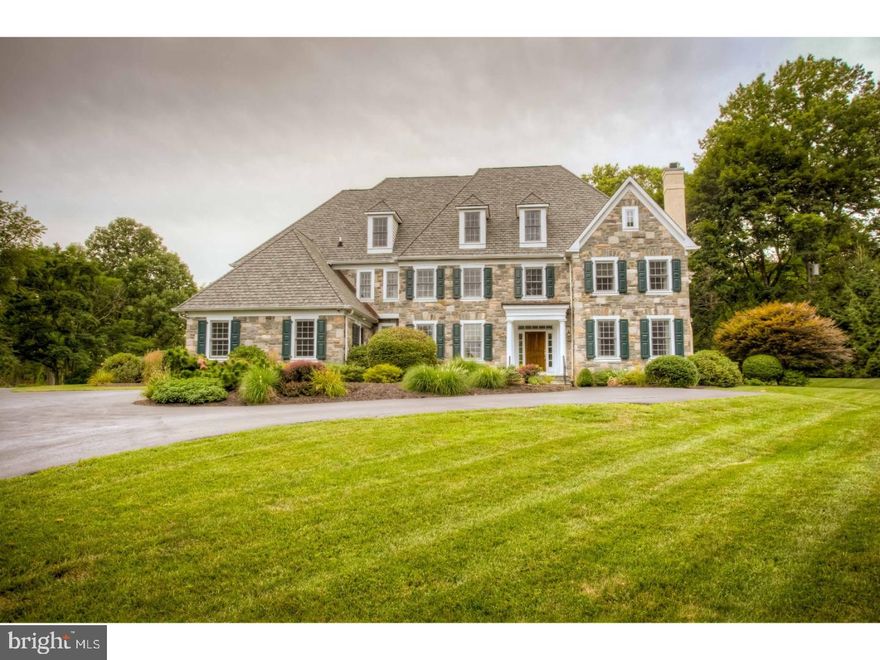 Located on one of Radnor Township's most desirable streets, this magnificent Colonial Manor home on 1.69 acres combines Main Line architecture and state-of-the art amenities. Quality and attention to detail are evident throughout the four floors of living space. Enter into the elegant straight through center hall with marble floors with oak turned staircase. To the right, enter into the elegant formal living room with gas fireplace, this leads into a cherry paneled study with a gas burning fireplace. To the left of the foyer, is a gracious formal dining room with beautiful on-site  hardwood floors with mahogany banding, wainscoting and crown molding. Enter into the gourmet kitchen with Woodmode cabinetry, granite counter tops and stainless steel appliances. Sun filled breakfast area with a wall of windows overlooks the picturesque rear yard. Kitchen area leads to an open great room with vaulted ceiling, hardwood floors and a wood burning stone fireplace. The first floor includes; two powder rooms, a spacious mudroom area with access to a three car garage and large pantry closet and rear staircase to upper level. Hardwood floors continue throughout all the rooms on the second floor. The spacious master suite features a large bedroom area leading to a study or dressing room. Master bath includes his and her cherry vanities with marble countertops, whirlpool tub and oversized marble stall shower. A large master walk in closet with shelving completes the suite. Second and third bedrooms feature an adjoining Jack and Jill bathroom. Bedrooms four and five feature their own baths. This level is complete with a large walk in laundry room, hall linen closet and access to finished third floor. Additional living space continues on the third floor with a large open space that could be used for a bedroom, au paire suite or large playroom. Full bath and a walk in closet with cedar paneling complete this level. Full finished lower level offers main room with kitchen, walk in climate controlled wine closet, wall of storage closets, powder room and a storage room. Beautiful, custom landscaped grounds with outdoor lighting. Convenient to train and major highways.