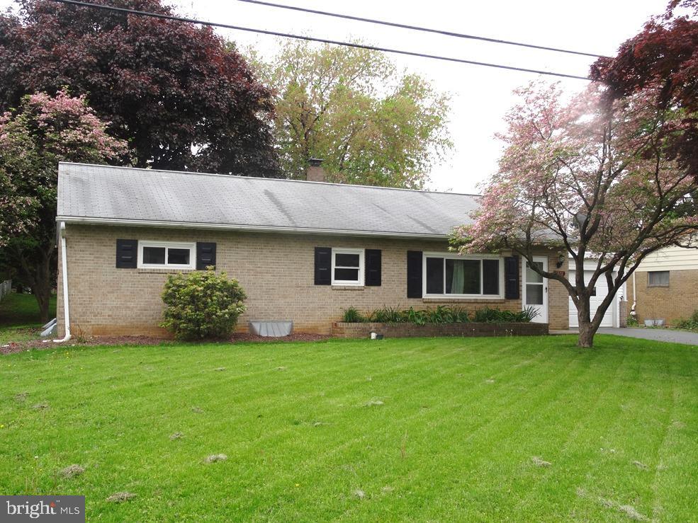 Freshly painted, refinished wood floor in Living Room, new windows, new hot water heater, hardwood floors under carpet. Beautiful family room with ceramic tile in lower level.