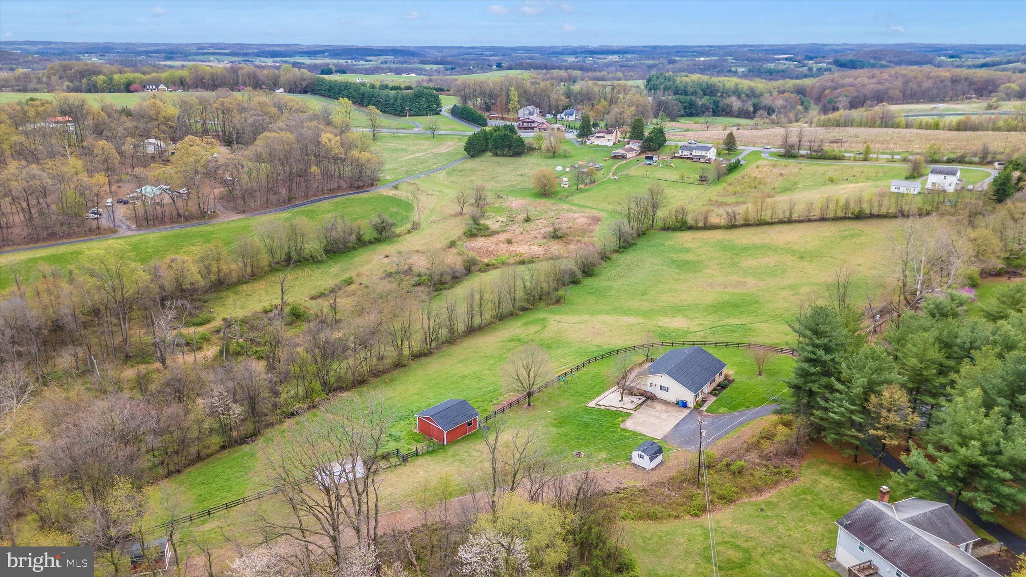 Bring your horses! Bring your other animals 4-H animals! 5 1/2 acres with over 4 1/2 acres of fenced rolling pasture! A beautiful property with large mennonite built 24‘ x 24‘ horse barn designed for equestrian use, a 12 x 12 amish built shed plus another 10 x 10 shed. The upstairs is a private, separate living space consisting of three bedrooms and 3 1/2 bath for your personal use, with rental income available with the additional two bedroom two bath in the walk-out basement. Basement is currently rented and could pay 1/2 your mortgage. Separate electric meters separate entrances, separate HVAC. New carpet upstairs, New roof on the house, the horse barn and the larger shed. New HVAC upstairs. Gorgeous must see property or personal residence or investment purposes or both!