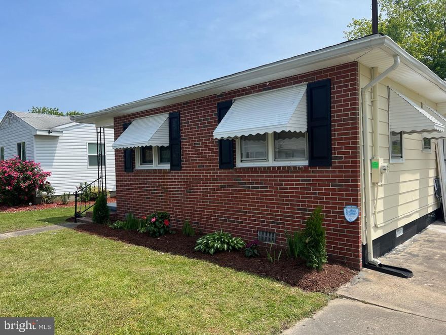 Lovely newly renovated ranch with brick front and original awnings. Cool and relaxing front or side porch.
Wide driveway with kitchen access side door.  You'll love the wide galley kitchen with table space. All new stainless appliances grace the working side of the kitchen. A family sized Frigidaire fridge. and 8 ft of granite on the other. Lots of cabinets,
Bar on the living room side has space for 4 bar stools. A bay window lights up the 17x11 space and shines on the new hardwoods.
Lots of bedrooms and baths, and 2 walk ins and a fireplace make this a cozy space. A walk in tubs and this becomes your forever home.
Come out and see this one level living at its best.