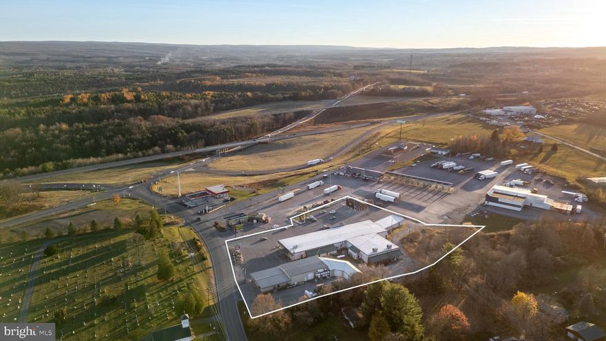 Prime Commercial Opportunity – Interstate 80, Exit 133 – Established Shopping Plaza on 3.9 Acres.    Don’t miss the chance to own Exit 133's only and largest shopping plaza located just feet from the exit, north of 4-way light at the intersection of I-80, Rt 53 and Rolling Stone Road  – a strategic commercial hub between the Clearfield and Bellefonte exits.   With over 55 years of continuous operation, this well-established property spans 3.9 acres and offers 26,440+ sq ft of leased commercial space under roof, serving as a vital economic center in the region.  Current tenants Include: U.S. Post Office, CNB Bank, District Magistrate’s Office, H&B Hardware Store, Laundromat, & Flower Shop.  Key features include: public water and sewer; 45+ paved parking spaces; high visibility and accessibility via Penn DOT road frontage; and ample expansion potential for new or national/regional tenants.  It is surrounded by strong anchor businesses: Roadhouse Restaurant, Kwik Fill Truck Stop and Motel, Kwik-Fill and Exxon Gas Stations.  There are no zoning regulations and no "non-compete" restrictions in place. 
This property offers tremendous upside potential with room to expand, reconfigure, or repurpose for new commercial concepts. Whether you’re an investor looking for stable income or a developer seeking a high-visibility site with growth opportunity, this shopping plaza delivers unmatched value and location.  Call for more details Schedule your private showing today and unlock the potential of this I-80 corridor landmark.  NDA required of Qualified Buyers for I&E reports.