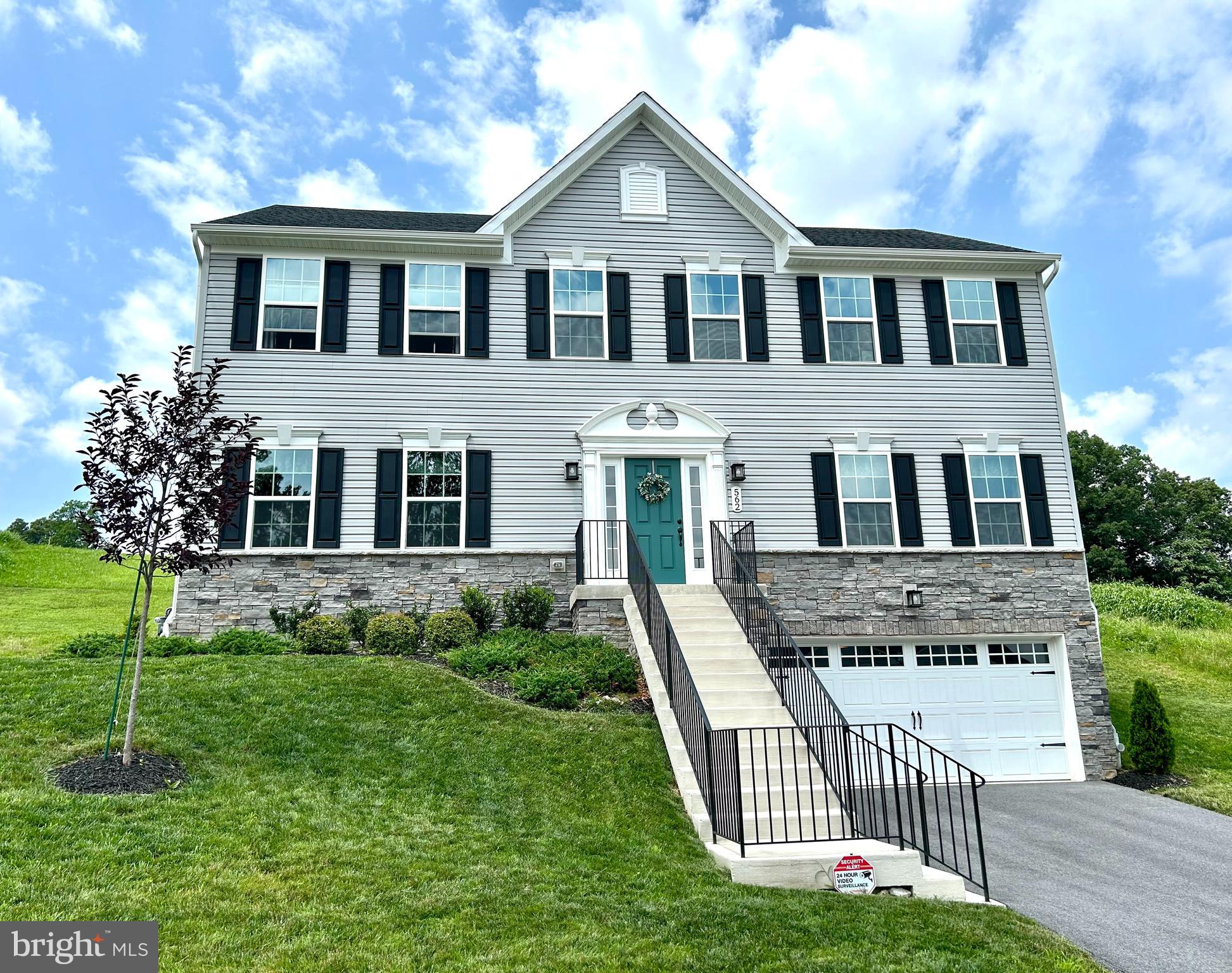 Welcome to 562 Monocacy Trail, in the one traffic light town of Spring Grove. Located in the subdivision of Spring Forge, this 4 BR, 2.5 BA, 2 Car Garage colonial may be just what you are looking for? Situated on over 3/4 of an acre of land and high on a hill, the view from the front windows, is picture perfect. The foyer greets you with 18' tall ceilings with a beautiful loft above, there is luxury vinyl plank flooring along with carpeting, upgraded quartz counter tops in the kitchen along with a center island, white cabinetry, stainless steel appliances, recessed lighting, double door pantry, separate laundry room (main level), formal dining and living room, family room off of the kitchen, partial stone front exterior, very large upper back yard, finished lower level with flex/study, easy access to shopping and restaurants and the local public library. There are several local parks, Codorus State Park and the property is not far from the rail trail, where you can enjoy walking, jogging, or biking. The home's height allows for privacy, not allowing anyone to see into your main level windows as they pass by. This design also allows for awesome views, lot's of sunshine and great winter time sled riding! Be sure to schedule your showing today!