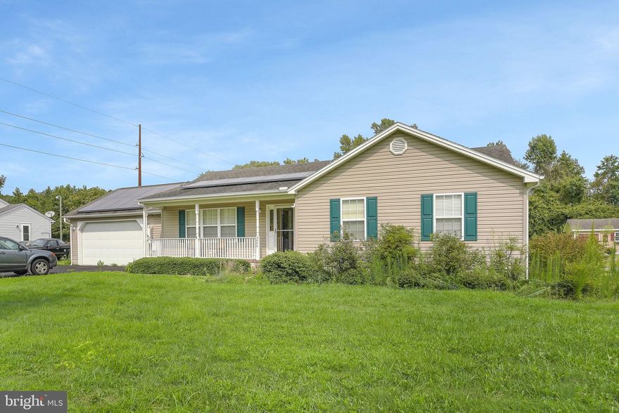 Three bedroom 2 bath custom built Rancher located between Salisbury and Ocean City on a half acre lot. Nice spacious back yard with plenty of room. Black top driveway with plenty of parking,  two car garage and a fenced in area off back deck.  Interior features include Large open floor plan with spacious eat in kitchen. hardwood floors throughout main living area, beautiful wood burning fireplace and a large owner suite with full bath.  The property is rather maintenace free with low energy costs from Solar panels as well. This affordable home is located in a quiet setting just 15 miles from the Beach.