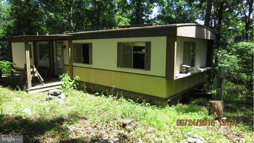 28 + or - acres on VDOT maintained road. Fabulous winter views and summer views if you cut down a few trees. Excellent home site for you custom built home.  Has under ground power line, well and septic. Buyer responsible for all inspections etc.                All personal property in hunting shack/shed and mobile home will convey with sale.  "SOLD AS IS"