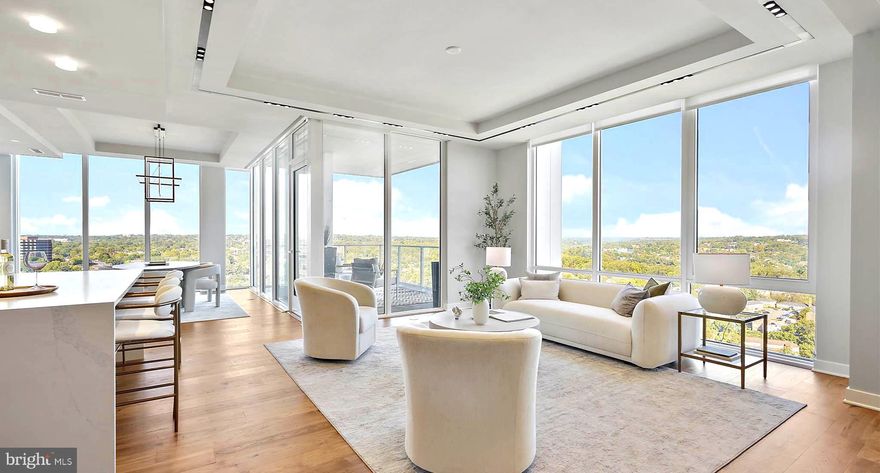 Perched above the Potomac River, this stunning 22nd-floor home at The Pierce redefines luxury living. It offers breathtaking panoramic views of the Georgetown skyline and daily sunsets, the perfect blend of city vibrancy and natural serenity. 

Floor-to-ceiling windows frame mesmerizing skyline views, while a private balcony provides a serene retreat to unwind in the glow of the city lights. Designed for comfort and refinement, every detail in this home reflects top-tier craftsmanship. The chef’s kitchen is a masterpiece, featuring Thermador appliances, sleek Snaidero cabinetry, and polished quartz countertops. A spacious waterfall-edge island is a striking focal point and a perfect gathering space. Thoughtful additions—such as a 42-bottle Thermador wine refrigerator, Wi-Fi-enabled wall oven and microwave, Bosch 800 Series dishwasher, and a walk-in pantry—make this kitchen as functional as it is stunning. The expansive living and dining area is ideal for entertaining, whether hosting an intimate dinner or a lively gathering. Hand-scraped hickory floors throughout the home add warmth and timeless charm.

The owner’s suite is a true retreat, offering breathtaking skyline views. A cozy reading nook provides the perfect space to unwind at the end of the day. The spa-inspired bathroom, adorned with marble accents and heated floors, delivers ultimate comfort and relaxation. A custom-designed walk-in closet provides ample storage while maintaining an elegant aesthetic.

The second bedroom offers privacy and comfort for guests, featuring its own ensuite bath and two spacious closets. A separate laundry room with a full-size washer, dryer, and wash sink enhances convenience, while a stylish powder room is thoughtfully included for visitors.
For those who work from home or seek a quiet retreat, the expansive den provides a tranquil setting with breathtaking views of the river and skyline.
 
 Beyond the residence, The Pierce delivers an elevated lifestyle with world-class amenities. A private elevator entrance from the lobby and parking level ensures seamless access and privacy. Residents enjoy a state-of-the-art two-story fitness center, including a full suite of fitness machines and free weights, as well as a yoga room; a resort-style 65-foot pool with an outdoor bar, lounge, and grilling area; and an elegant club room with a fireplace and bar—perfect for entertaining. In addition, a conference room is available. 
 
The rooftop terrace offers a gourmet cooking space, stylish lounge areas, and sweeping panoramic views of the capital’s monuments, providing the ultimate urban escape. Additional conveniences include on-site bike storage, electric vehicle charging stations, a dog-washing station, and two premium reserved garage spaces, steps from the private elevator. A 24-hour concierge service ensures every need is met with exceptional care.


Located in the heart of Rosslyn, this residence provides easy access to daily conveniences, restaurants and cafés, and yoga studios. Everyday essentials, such as Safeway, CVS, and Target, are conveniently located nearby. Freedom Park, Gateway Park, Roosevelt Island, and the Mount Vernon Trail bike path along the Potomac offer nature lovers peaceful green spaces. With Ronald Reagan Washington National Airport just a short drive away, business trips or weekend getaways are incredibly convenient. A quick walk to the Rosslyn Metro (the Blue, Orange, and Silver lines) connects you seamlessly to downtown DC, and beyond, while Georgetown is accessible via a walk across the Key Bridge. Whether indulging in fine dining, enjoying world-class performances at the Kennedy Center, or exploring waterfront trails, every experience is within easy reach.

For those seeking a rare blend of luxury, convenience, and breathtaking views, this residence presents an extraordinary opportunity to call one of Arlington’s most desirable addresses home.