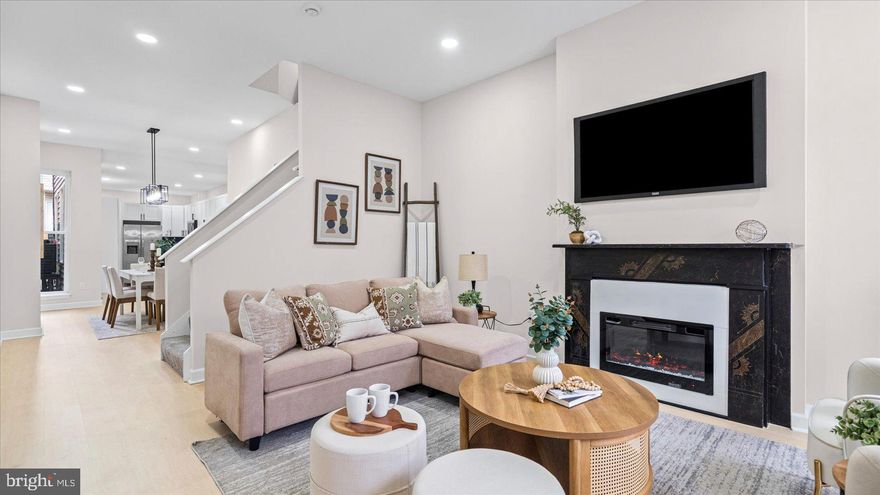 Welcome home to 1612 E Biddle St. This modern 4 bedroom, 3 full 2 half bath home with 4 finished levels has all the upgraded finishes you can ask for! As you walk through the front door, you’re greeted by the charming living room featuring a stained glass window over the entry door offering timeless charm. The living room features a cozy fireplace and transitions seamlessly into the dining room and newly updated kitchen with stainless steel appliances, quartz countertops, tile backsplash and a breakfast bar. The second floor includes the primary suite, featuring a walk-in closet and private en-suite bathroom with new upgraded vanity, tile flooring and upgraded walk-in shower. Just down the hall is bedroom 2 and an additional full bathroom with modern upgrades and a convenient laundry closet with new stackable front-loading washer & dryer. The third floor includes two generously sized bedrooms and a full bath. The fully finished basement offers a family room that can also be used as a home office or home gym and offers an additional bathroom. Convenient commuter routes to I-395, I-95, rt 40 and easy access to the National Aquarium, Pier 6 at the Inner Harbor, MECU Pavilion and Johns Hopkins.