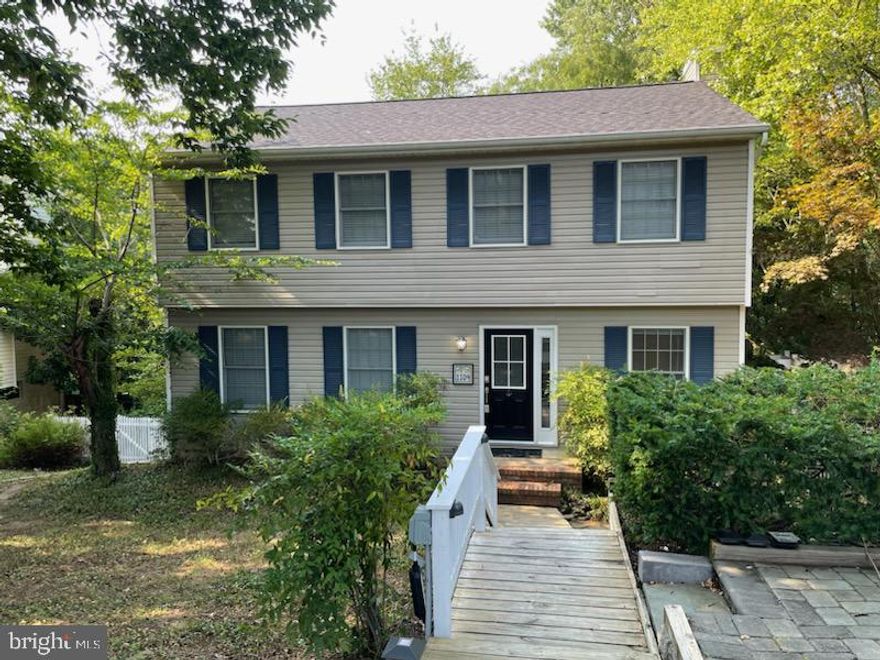 DO NOT MISS! Lovely Wooded 4 BR 2 1/2 BA colonial in desirable water access community of Cape St. Claire. Enter into this charming well maintained center hall colonial with living room, dining room, kitchen with generous breakfast space and cozy wood burning fireplace. Private Primary Suite with balcony overlooking the backyard oasis. 3 generously sized bedrooms and a full bath round out the upstairs. 2000 sq ft of finished living space plus a large unfinished walkout basement waiting for your imagination. Large deck off the kitchen with staircase to bricked patio and backyard. Hardscaped 2 car driveway with 50 amp electric car charger. Conveniently located close to shopping, commuter routes, schools, and downtown Annapolis.