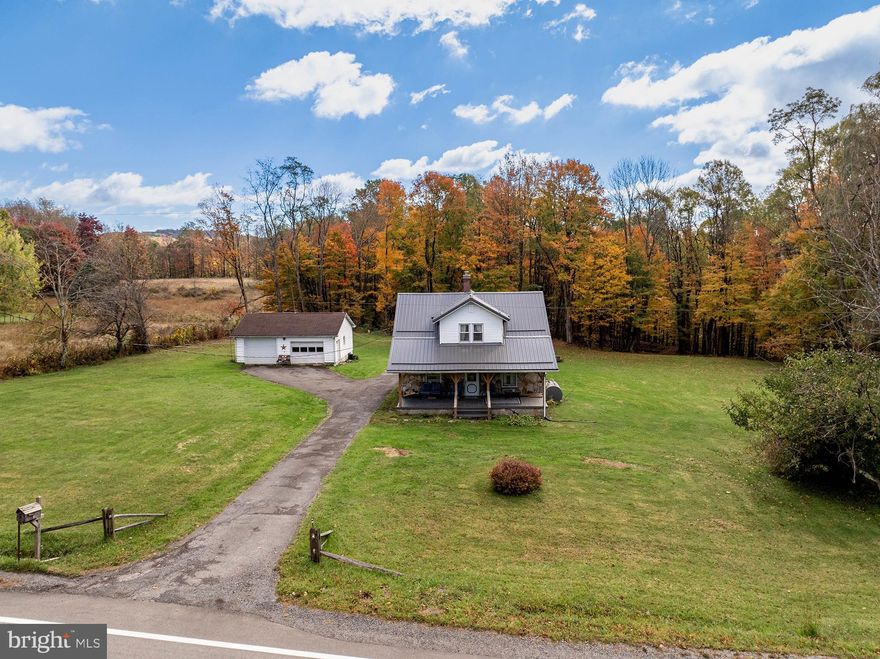 Nestled in the heart of West Virginia, this absolutely charming 3-bedroom, 2-bath stone home sits on nearly 3 acres of picturesque land, complete with your very own pond and apple trees. The large, level yard is perfect for outdoor fun, while the mudroom-turned-sunroom offers a cozy space to soak up natural light all year round. Inside, you’ll find stunning hardwood floors throughout, adding warmth and character to every room. The home has been remodeled over the years and features a recently updated, relaxing front porch with Trex decking—perfect for sipping morning coffee, and easy to maintain. Forced air heat, electric baseboard, and a cozy pellet stove set in a beautiful stone fireplace. The 20x30 two-car detached garage is equipped with both electric and heat, making it an ideal workspace or storage area. With a 2-year-old metal roof and a well-maintained interior and exterior, this home is as adorable as it is functional—a true gem waiting for its next loving owner.