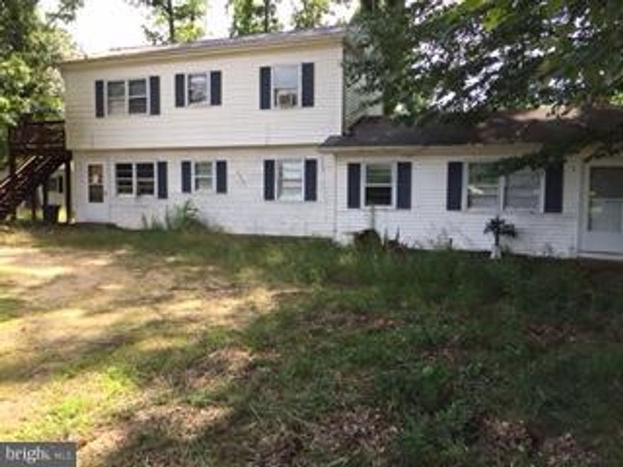 INVESTORS - This building houses 3 one bedroom apartments. None are currently rented and the building is uninhabitable at this time. It was previously an active rental - and there is great potential here. SOLD strictly AS IS.  Personal rep has little knowledge about the property, and will make NO repairs. Cash or conventional only. Great central location near everything.