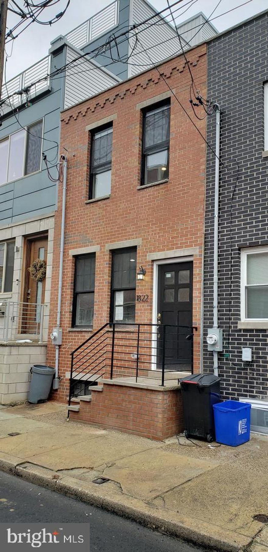 Beautifully renovated home on a quiet street in Point Breeze! Enjoy a spacious living room with tall ceilings, modern LED lighting, and contemporary flooring. The sleek kitchen features gray shaker cabinetry, stainless steel appliances, granite countertops, and a stylish tile backsplash. Relax in the private, low-maintenance backyard or the finished basement with high ceilings and a powder room. Upstairs, find two spacious bedrooms and a luxurious full bath. Convenient main-floor laundry. Prime location near Passyunk Square, Broad Street subway, Lincoln Square, and Wharton Square Park. Schedule your showing today! Tenant pays utilities, including a $60 water fee. All square footage numbers are approximate and should be verified by the buyer. It is the responsibility of the buyer to verify real estate taxes.