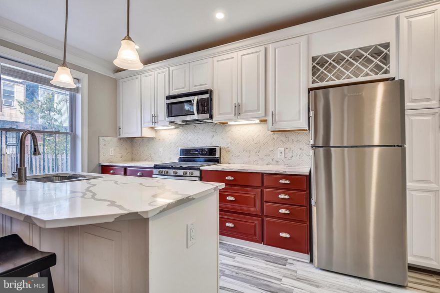 Brand new, Stunning renovation with meticulous attention to detail located only 1/2 block from Carroll Park! 2 Beds and 2 Baths with all new plumbing, electric, windows, doors, roof, appliances, systems and more. Open floor plan conjoins spacious living room, dining space and gorgeous chefs kitchen with Quartz counters, Stainless appliances, built in wine rack and pantry space. The rear yards has a new privacy fence making indoor outdoor entertaining a breeze. Enjoy the spacious Master Bedroom with luxurious En Suite bath and Large 2nd bedroom with equally sophisticated hall bath.  Dual skylights flood the 2nd floor with natural light, adding charm and showcasing the distressed brick accent walls that were brought back to life throughout the house. This house has it all! Conveniently located close to University of Maryland, Downtown Baltimore, Sports Stadiums, and beautiful Carroll Park  with playgrounds, sports fields and walking paths. Relish in all that city living has to offer!