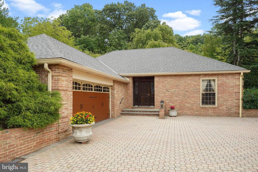 The well manicured, tree lined driveway opens to an oversized courtyard.  A secluded all brick ranch style  carriage house is nestled on a wooded 4 acre lot adjacent to the main house .  This rental  includes multiple TV's, small and large appliance, dishes, pots and pans as well as kitchen utensils, washer and dryer, bedding and towels. Totally equipped, fully furnished, and ready to move in, this executive style rental will accommodate a 3 , 6 month or 1 year lease . Two large bedroom with double closets and a first floor laundry are located on the main level of this  furnished home.  The kitchen features updated appliances, ample cabinets and center island.  the dining area opens to a walled patio with grill and patio furniture.  A well lit family room with tray ceilings and tall windows, first floor laundry, newly remolded bath and 2 large bedrooms complete the main level of this home.  The lower level was updated  and includes a large rec room with wrap around custom wet bar, extensive closets, a full bath with soaking tub, a third bedroom/ bonus room with ensuite bath .  This walk up lower level has an additional  walk in closet and storage area.   The two car attached garage opens to the main foyer of the home.  Additional features: central air, water softener and a back up generator.  Lawn and snow removal as well as trash are included.   Minutes from Rt 202 and Rt 29, Wegmans and the  Rt 29  entrance to the turnpike.   No sign at the property. Please make an appointment prior to driving down the  private drive.