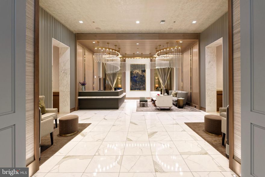 Gorgeous, wonderfully secure, luxurious two bedroom condo with the most incredible amenities! It's bright, open & quiet and has beautiful high ceilings, a spacious gourmet kitchen and lovely private balcony. Located in Ritz-Carlton Residences in Chevy Chase with 24 hour valet service to park your car, 24/7 concierge, a doorman, porter service, and an onsite management & building engineer. Then there is the 7th floor: 12,000sf dedicated to its residents- fitness center, multiple club rooms, onsite catering kitchen and outdoor spaces for lounging or entertaining along with BBQ grill & fire pits, and free wifi throughout the building. The condo is equally impressive. But first, it’s important to note that it is located on the front side of the building, a significant asset. It allows for fabulous views of trees and the charming colorful park from all windows and the balcony. You can even hear the waterfall when you are reading, relaxing or just "people watching" on your balcony. Now for the interior. Entering the condo—through its foyer—you will immediately notice the gorgeous wide-plank white oak flooring, high ceilings and beautiful lighting. Its spacious gourmet kitchen will be on your right, with top-of-the-line Bosch appliances, Italian solid wood cabinetry and enough counter space to delight the best of cooks. There is a large dining area on your left which flows into a wonderful living space and then onto its lovely, private and quiet balcony (with space for table & chairs). The spacious primary bedroom includes the perfect built-in closet along with a gorgeous spa-inspired bath-Carrara marble, soaking tub, big frameless shower—everything you would expect of a Ritz-Carlton bath. The second bedroom is also a good size with its own impressive bath. In addition, there is a powder room for your guests and a laundry room with space to spare located off the foyer. The property includes two secure parking spaces and a storage unit. Grocery, pharmacy, restaurants, and more are on the Square; the Capital Crescent Trail is nearby, as is the new Purple Line. It’s a remarkable home! Come see for yourself. In keeping with the privacy and security of a Ritz Carlton Residence, open houses are not permitted. If you're working with an agent, have them arrange for a private showing. If you have no agent please call the front desk at the Chevy Chase Ritz and ask them to have me call you. I'll gladly show you.