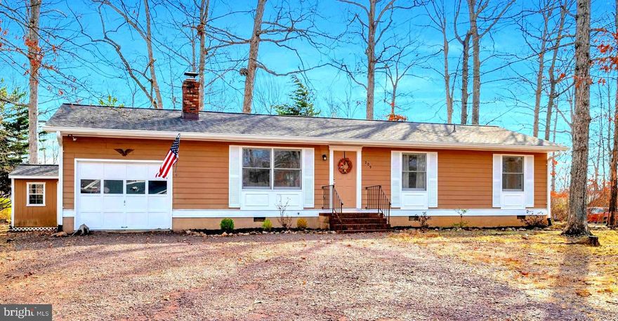 Welcome home to 209 Limestone  Lane! Located on a large corner lot backing to the golf course in the beautiful Lake of the Woods community.  Step into a cozy living room with a wood burning brick fireplace and built in book cases. The spacious eat in kitchen has plentiful cabinets and a pantry.  Access to the large back deck is sure to be pleasing on those lovely weather days and great for entertaining. The spacious Owner's suite with bright windows offers a roomy en-suite bathroom with double sink,  a walk in closet as well as an additional large closet.  Two driveways and the oversized one car garage provide for plenty of parking.  A private, gated, secured community, Lake of the Woods offers anything and everything you could possibly want. Home to two lakes (the 550 acre main lake and a 35 acre "fishing lake"), a golf course, an equestrian center, a fire and rescue department, and a church all within the gates, Lake of the Woods simply has it all. Whether your passion is boating, water skiing, kayaking, golfing, horseback riding, or simply taking in the breathtaking views from the clubhouse while enjoying a fabulous meal, from your own deck or yard, or from one of the beaches, you won't be disappointed! Perhaps you'd like a game of bridge or volunteering your time and talents...Lake of the Woods offers more than 60 clubs and/or organizations from which you may choose to become involved. Located in Orange County, we are fortunate to enjoy low real estate taxes. Coupled with home prices ranging from the high-$200,000s to over $2,000,000, Lake of the Woods is the perfect community for both full-time residents, as well as weekenders. But don't take my word for it, please come see for yourself! I will gladly give you a tour of Lake of the Woods by boat and by car so that you may experience why I love Lake of the Woods!