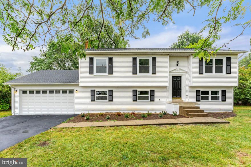 Discover the charm of this beautifully renovated 4 bedroom, 3 bathroom home, offering 2,214 square feet of living space. This delightful residence features a spacious layout with brand new LVP throughout. Three bedrooms and two baths on the upper level, and a private bedroom and bath on the lower level. The fully fenced backyard, complete with a covered deck off the kitchen, is perfect for gatherings, pets and privacy. The kitchen has been entirely redone with stylish cabinets, quartz countertops, and a fresh set of appliances. Each bathroom has been renovated with new tile, vanities, fixtures. With a new roof, new windows, fresh paint, and a recently serviced HVAC system, every detail has been carefully attended to. The 2-car attached garage offers convenience and ample storage. Experience the perfect blend of style and comfort in this enchanting home, ready to welcome you. Owner is RE Licensee. Professional photos available this weekend.