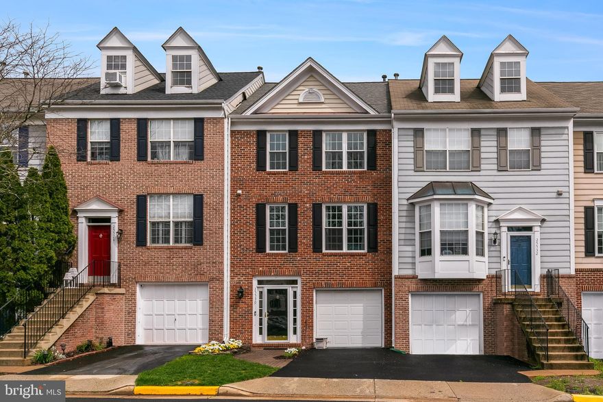 ***Open House 4/12/25 had been cancelled***Tucked into a peaceful square in the heart of South Riding, this beautifully updated brick-front townhome offers something rare—a true sense of calm and privacy, surrounded by nature, with the convenience of daily life just steps away. Backing to a canopy of mature trees and spread across three thoughtfully finished levels, this is the kind of place that instantly feels like home.

Step inside to a soaring two-story foyer where a custom built-in bench and coat rack make an inviting and practical first impression. The entry level sets the tone for flexibility and comfort, featuring a quiet rec room with a cozy gas fireplace—ideal for movie nights, a home office, or simply a space to unwind. A door leads to a brick paver patio nestled against the treeline, where mornings feel peaceful and evenings stretch a little longer. This level also includes a spacious garage with plenty of storage (and room for an extra fridge), a laundry room, and a flex space currently used for storage that could easily be converted into a powder room.

Upstairs, the main living level is open, bright, and perfect for both entertaining and everyday living. The expansive living room flows seamlessly into a tastefully renovated kitchen and breakfast area, where crisp white cabinetry, granite countertops, a stylish subway tile backsplash, and sleek black appliances create a polished and modern aesthetic. Just beyond, a sun-drenched bonus room with vaulted ceilings offers a quiet corner to sip your coffee, work on a puzzle, or curl up with a book. Step out onto the deck and take in the privacy and greenery that make this home feel like a hidden retreat—right in the middle of it all.

The top floor is home to a serene primary suite, complete with vaulted ceilings, abundant natural light, and a walk-in closet with custom organization. The en suite bath is a calm, spa-like space featuring wood-look tile, dual vanities, and clean, classic finishes. Two additional bedrooms, each spacious and filled with light, share a hall bath and offer flexibility for guests, children, or home office needs.

Notable updates to the home include windows replaced (2021), fresh carpet (2021), Kitchen updates including granite counters (2021), roof (2019), water heater (2017). 

Living in South Riding means more than just a beautiful home—it’s about lifestyle. Residents enjoy access to five pools, tennis and pickleball courts, basketball courts, a dog park, disc golf, playgrounds, fitness paths, two fishing piers, and even a public golf course. Whether it’s a morning walk on the trails or an afternoon at the pool, there’s always something to enjoy. Conklin Park and Dulles South Rec Center offer even more ways to stay active and engaged. And when it’s time to run errands or treat yourself, you’ll love being a short walk to Starbucks, Duck Donuts, groceries, and restaurants. Major commuter routes and Dulles Airport are just minutes away.

With its blend of thoughtful updates, flexible spaces, and an unbeatable location, this South Riding home offers a lifestyle that’s grounded, connected, and full of possibility. Come experience it for yourself—you just might never want to leave.