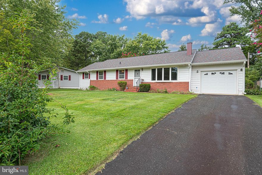 Everything you want in this attractive 3 bedroom 2 bath brick ranch style home. Features wood floors, fireplace, den, screened in porch and attached garage on just over a  quarter acre on a nicely landscaped lot.
Public water and sewer with outstanding convenience to Town of Easton but no town taxes.