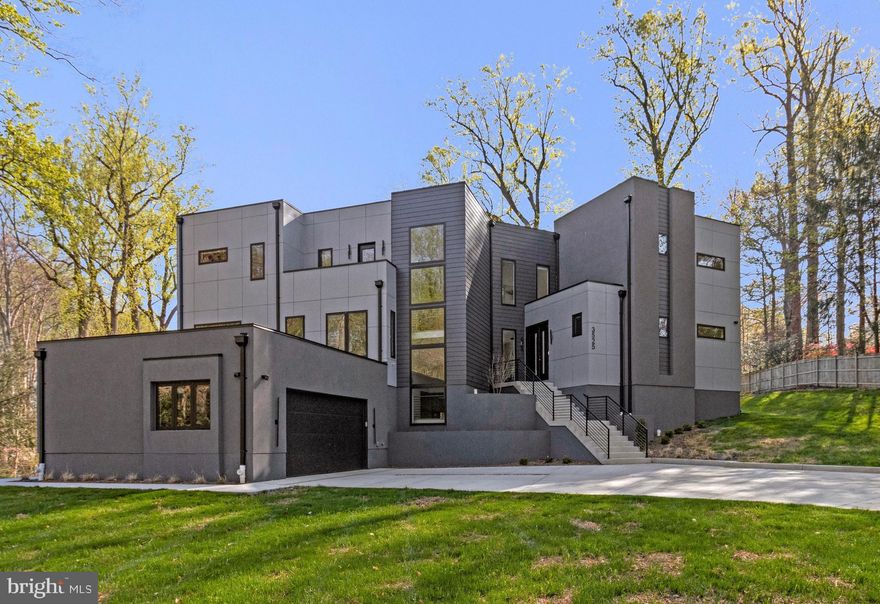 Custom-built and completed in November 2025, this stunning contemporary residence is tucked away on a quiet cul-de-sac in sought-after Mantua on a premium one-acre lot. Surrounded by distinctive upscale homes, the property offers a rare combination of modern style, quality construction, and a tranquil setting. Designed for comfort and flexibility, the home includes an elevator providing easy access to all three finished levels.

The entry level features an exceptional in-law or au pair suite with its own living area, kitchenette, and 2nd laundry room, offering the potential for fully independent living. Additional bedroom, Exercise-gym or flex room.   On the main level, the light-filled living room showcases a fireplace and dramatic floor-to-ceiling windows. The adjacent gourmet kitchen, complemented by an enormous pantry, creates a true chef’s paradise. This level also includes a separate dining area, private office, guest bedroom with full bath, powder room, and a  balcony ideal for outdoor entertaining.

Upstairs, the luxurious primary suite offers a spacious walk-in closet and spa-inspired bath. A second primary suite and an additional upper-level bedroom with en-suite bath provide excellent space and privacy for family or guests. Laundry room on upper level.  Additional highlights include a side-loading 2-car garage, expansive fenced yard, full-yard irrigation system, and quality exterior materials including HardiPanel, lap siding, and stucco. A 1-year builder’s limited warranty for workmanship and materials remains in effect through November 5, 2026, along with a 10-year structural warranty.

This modern custom stylish  home  has over 6,000 finished square feet, 6 bedrooms, 6.5 baths and  is located just outside the beltway and close to other major commuting routes :  I-66, I-395, 29 and 50.  Dunn Loring and Vienna Metros close by.  Fairfax Hospital just 5-8 minutes drive.  The wonderful Mosaic shopping center with its Farmers market, shops and restaurants is nearby.  Mantua neighborhood offers a Swim and Tennis Club, many clubs and activities and a great sense of community.  Woodson HS.