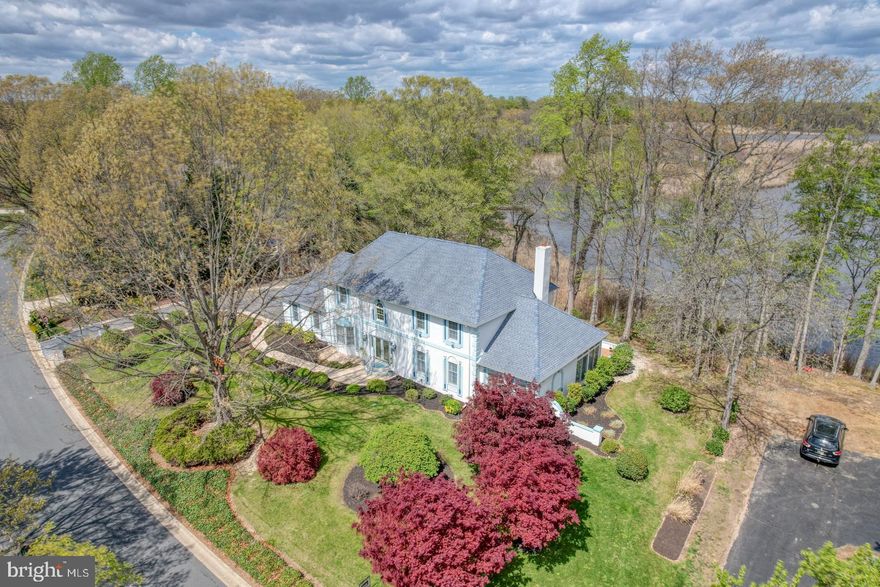 Welcome to your waterfront dream home, nestled in Windswept, one of the most prestigious neighborhoods in Kent County. This exceptional property offers an unmatched blend of luxury, privacy, and natural beauty—perfectly situated with breathtaking views as it backs directly to the tranquil river.
From the moment you arrive, you’ll be struck by the home’s timeless elegance and stately curb appeal. Inside, you’re greeted by an expansive, light-filled layout designed for both comfort and entertaining. Several windows throughout frame stunning river views, creating a warm, inviting ambiance in every room.
The gourmet kitchen is a stunning centerpiece, equipped with elegant custom cabinetry, and a spacious island ideal for entertaining. The home offers a variety of beautifully designed living spaces, including a formal living room, a formal dining room perfect for hosting, a bright and airy sunroom with views of the backyard, and a dedicated game room for fun and relaxation. Throughout the main level, beautiful flooring, intricate trim work, and a cozy fireplace add warmth and character to the layout.
Upstairs, the four generously sized bedrooms provide both comfort and flexibility to meet any lifestyle. The luxurious primary suite serves as a peaceful retreat, featuring a spa-inspired bathroom and sweeping, unobstructed views of the river—offering the perfect blend of elegance and serenity.
Out back, step into a private oasis where mature landscaping leads to the peaceful banks of the river. Whether you're kayaking or enjoying a quiet evening on the patio, this riverfront setting offers a lifestyle of both relaxation and adventure.
This rare offering combines luxury, location, and the unique charm of waterfront living in one of Kent County’s most sought-after communities. Don’t miss the opportunity to call this stunning property your forever home.