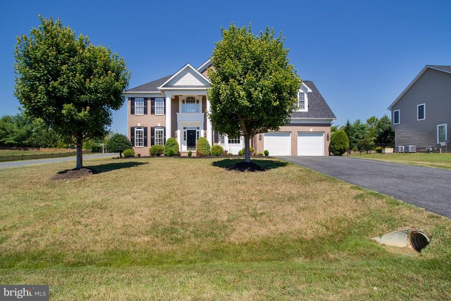 A grand two story foyer welcomes you when you enter this meticulously maintained Augustine home.  This spacious colonial boasts high end finishes throughout, a two story light filled family room with a fireplace, a main level office, and gleaming hardwood floors.  Just off of the gourmet kitchen is a gorgeous sun room with marble flooring and floor to ceiling windows.  Kitchen features include a large center island, stainless steel appliances, and gas cook top.  Fully finished basement complete with a recreation room, theater room, and game/exercise room.   Master suite with large sitting room and over sized walk-in closet.  Don't miss your chance to live in this golf community with pool, club house, tennis and jogging/walking trails!