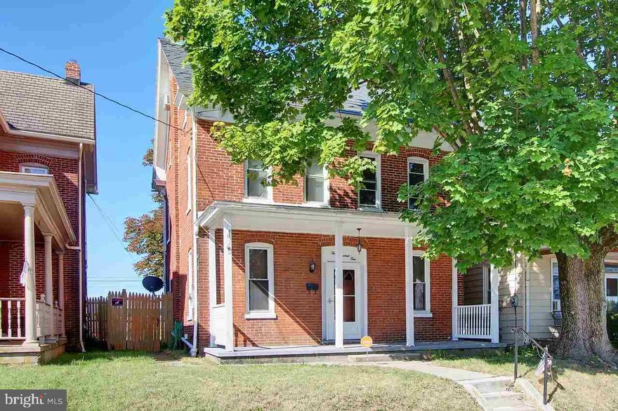 Charming 4 bedroom, 2 bath home in Dallastown Boro. This updated brick 3 story is conveniently located w/large covered front porch, fenced yard + 2 car carport & storage area. Spacious kitchen w/ceramic tile flooring, plenty of cabinets & newer appliances. Separate dining room, living room, full bath and laundry on 1st floor. 3 Additional bedrooms & full bath on 2nd floor. 3rd floor can be 4th bedroom, office or extra living space!