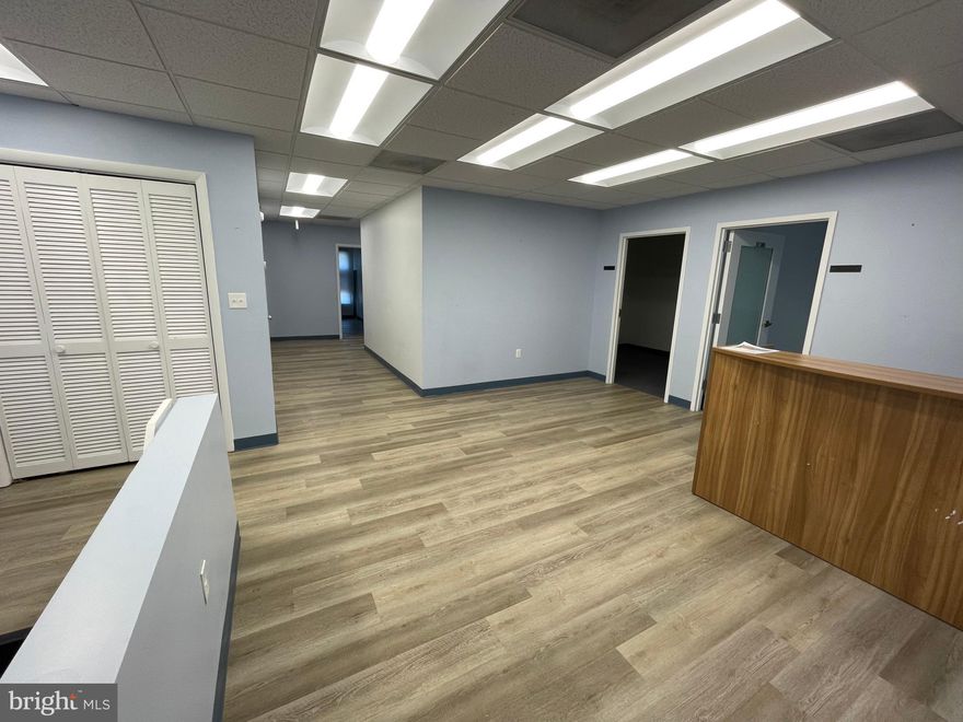 Well-Configured Office Suite with Natural Light and Functional Layout
This suite features six private offices, offering ample space for focused work or individual team members. A welcoming reception area with a built-in desk creates a polished entry point for visitors and clients.

The space includes a breakroom for added convenience, though it is not equipped with a kitchenette. Durable luxury vinyl plank (LVP) flooring runs throughout the common areas, providing a modern, low-maintenance finish, while private offices are carpeted for comfort.

Operable windows allow for fresh air and natural ventilation, enhancing the overall work environment.

Prime Location with Exceptional Accessibility
Ideally situated within walking distance of the vibrant Rockville Courthouse district, this office space offers convenient access to a wide range of services and amenities. Tenants and their clients will appreciate ample on-site parking, ensuring hassle-free arrivals and departures.

Just 0.2 miles from Rockville Metro and 0.3 miles from Rockville Town Center, the location provides seamless connectivity and access to shopping, dining, and entertainment options. Positioned just off Route 355, this space combines visibility with easy commuter access, making it an ideal choice for growing businesses.