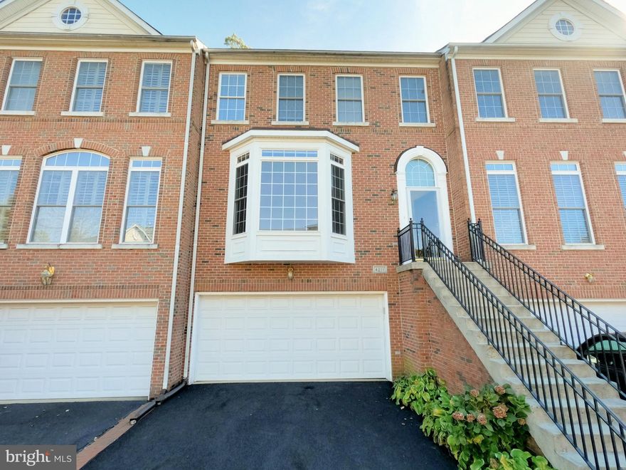 Stunning home in sought after neighborhood of PARKSIDE! The main level gleams with hardwood floors and bay windows. Gourmet kitchen with an island adjacent to the family room. The breakfast room steps out to the deck overlooking trees. Owner retreat with hardwood floors has 2 walk-in closets. Luxurious master bath with soaking tub. 2 large additional bedrooms also adorned with hardwood flooring. Laundry room located on the upper level for ease. The recreation room has a third full bath, a cozy gas fireplace, and a private office that steps out to a quiet courtyard. Close to major commuter routes, Wegmans and Fairfax Corner with boutiques, dining, and entertainment. A+ residence in a superb location!