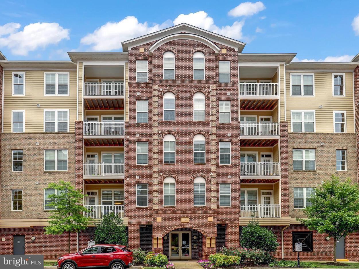 **Price improved** Welcome to this exquisite Discovery Square condo, a light-filled 2-bedroom, 2-bath gem on the 5th level with convenient elevator access. The open floor plan is highlighted by a gourmet kitchen featuring stainless steel appliances, granite counters, and upgraded cabinets. Enjoy the luxury of double sinks in the bathrooms, walk-in closets, and a spacious balcony perfect for relaxation. Additional perks include an assigned parking spot in a gated garage, ample storage, and in-unit washer/dryer. Ideally situated near Dulles Airport with easy access to I-66, Rt 50, and Rt 28, this condo combines modern elegance with unparalleled convenience.