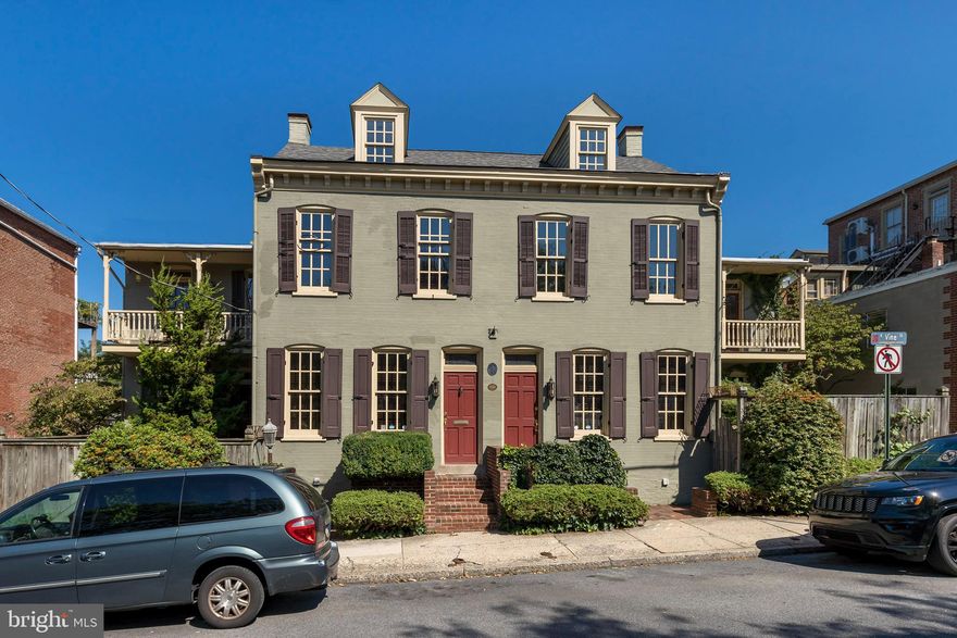 This beautiful, Historic, Stately home is located in the "Old Town" section of Lancaster City.  You are only a few minutes from Downtown Lancaster and all the amenities that Downtown affords.  With just over 4,000 square feet of finished space this house affords numerous opportunities.  This home offers 4 bedrooms but the two lofts give you the potential for 2 additional bedrooms or use the loft space as a study/office.  Two of the four bedrooms are primary bedrooms with primary bathrooms.  The kitchen is a wonderful open space that flows into the dining area.  Two large living rooms/family rooms on the main floor and library with a wet bar.  The lower level has a small kitchen, half bathroom, bedrooms and living room with the other side of the lower level boasting a finished rec room.  The outside had two private (fenced in) patio areas and two off street parking spaces.  Three zone heating and cooling with a brand roof also.  Pack your bags and move into 151-153 E. Vine Street.