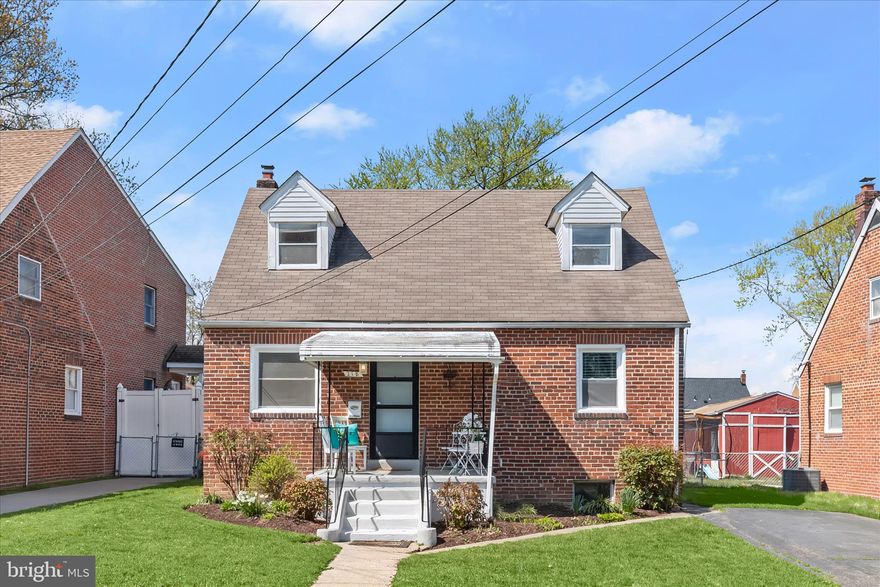Brimming with charm and character, this all-brick Cape Cod welcomes you with a covered front porch and timeless curb appeal, all set on a spacious lot with a fully fenced backyard. Inside, neutral paint colors and hardwood floors flow throughout, creating a warm and cohesive feel across every level.
The main level unfolds with a comfortable living room that transitions seamlessly into a dedicated dining room just off the kitchen, offering an ideal layout for both everyday living and entertaining. The kitchen is equipped with a gas range, stainless steel refrigerator, and direct access to the backyard, making indoor-outdoor living effortless. Two main level bedrooms, including the primary, provide convenience and flexibility, complemented by a beautifully updated full bath featuring a modern vanity and a floor-to-ceiling subway tiled shower.
Upstairs, a private third bedroom adds additional living space, perfect for guests, a home office, or a quiet retreat. The lower level expands the home’s versatility with a spacious recreation room suited for a variety of uses such as a family room, hobby space, or exercise area. An additional full bath on this level has been thoughtfully updated with a floor-to-ceiling tiled shower accented by mosaic details, while a separate utility room includes laundry and extra storage.
Out back, the fenced yard offers plenty of room to relax, play, or garden, complete with a storage shed for added convenience.
Ideally situated in a well-established neighborhood, this home provides easy access to shopping, dining, and major retail along Ritchie Highway, as well as nearby parks, schools, and community amenities. Commuters will appreciate the close proximity to MD-100, I-97, BWI Airport, Baltimore, and Annapolis, making travel in any direction both simple and efficient. Please note: photos depicting furniture have utilized virtual staging.