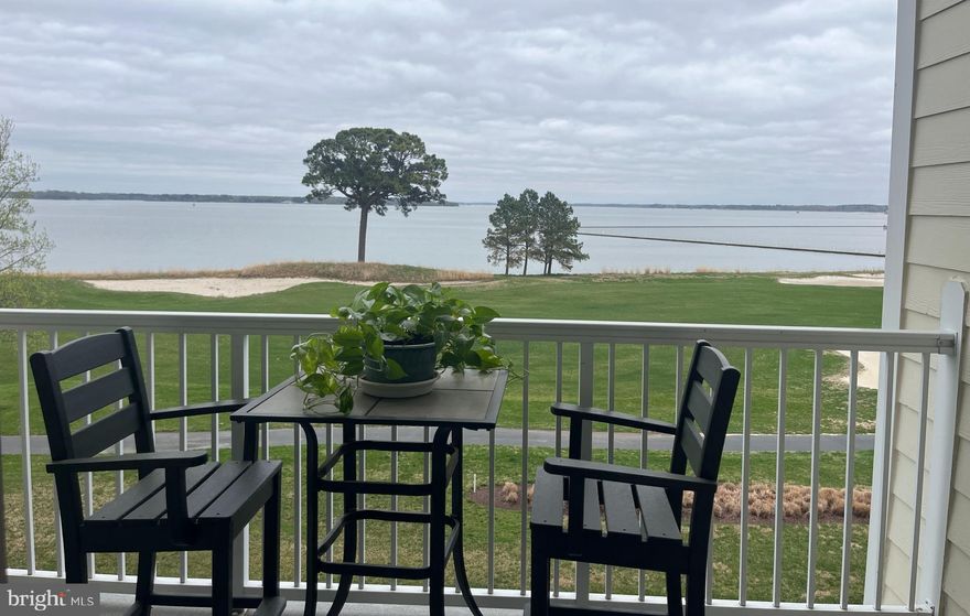 Residences at River Marsh offers carefree living.  Enjoy sunrises and sunsets from your private balcony  overlooking the 18th fairway and the Choptank River.   Your condominium building offers secure entrance to a welcoming lobby and a main level parking garage.  On the 2nd floor you'll find #206 tastefully decorated with gleaming hardwood flooring, chair and crown moldings, tray ceilings and stunning views from the living room and bedrooms. Fully equipped kitchen features a new dishwasher,  breakfast bar seating, panty and spacious utility room providing additional storage..  New water heater.  Primary bedroom has walk-in closet and bath with soaking tup, separate shower and double vanities.  Short term rentals are not permitted.  Plans for a new club house, pool and tennis courts are in the works.  Luxury living is waiting for you! One time capital contribution fee of $926 is required at settlement. Front foot benefit fee of $400 is due annually.
