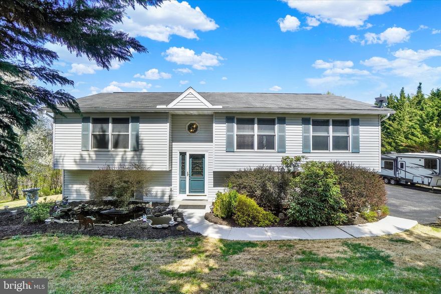 Welcome to 116 West Court, a lovely 3 bedroom, 2-1/2 bath home tucked away on a desirable .63-acre in historic Glen Rock Borough.  This one-owner home offers 3 bedrooms and 2-1/2 baths, an oversized two-car garage and low maintenance LVP flooring throughout.  
The main level of the home boasts a large living room, a cheery kitchen with adjoining dining room and sliding doors leading to the rear decks, perfect for grilling and outdoor dining. The private primary suite with an updated ensuite bath offers an additional sliding door with access to the decks, great for relaxing and watching the stars at night or enjoying your morning coffee! The finished lower level adds substantial living space with a family room, a convenient laundry area, and a half bath. Step out through the sliding door to the rear patio and enjoy the luxurious hot tub, perfect for year-round relaxation!

The decks and patio are ideally situated for wildlife and bird watching, in particular the hummingbirds that return every year!  Practical features of the property include a built-in, oversized two-car garage, a handy storage shed, public water and sewer, plenty of additional parking, and an electric hook-up for an RV or electric car charging.  

This property offers a private, rural setting, yet is conveniently located minutes from I-83 Exit 8, for an easy commute to Hunt Valley or Harrisburg, and just a short drive to shopping, dining and schools.  Enjoy the charms of small-town living, including the world-famous Glen Rock Carolers on Christmas Eve, bike and hike on the York County Rail trail and ride the Steam Into History Train!

All appliances are included, as well as a one-year First American Home Warranty for your peace of mind.  Seller Incentive: With an acceptable offer, the seller is willing to install a brand new 30-year architectural shingle roof prior to settlement! This is a fantastic opportunity.