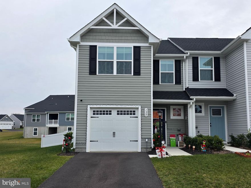This stunning duplex at 124 Bibury St offers modern living in Martinsburg's desirable neighborhood of Arcadia North. Built in 2024, this like-new property combines contemporary design with practical comfort across 1,454 square feet of thoughtfully planned space. The open-concept main level seamlessly connects the kitchen, living room, and dining room, creating an ideal environment for both daily living and entertaining. The kitchen features a convenient pantry for ample storage, while luxury vinyl plank flooring and carpet throughout the home provide durability and style. The fenced backyard offers privacy and space for outdoor activities, perfect for relaxation, entertaining, or letting children and pets play safely. 
Located in an ever-growing Martinsburg neighborhood, this property provides excellent access to local amenities and transportation options. Martinsburg High School sits approximately one mile away, making this an attractive option for families with school-age children. The nearby train station offers convenient commuter access, while Interstate 81 provides quick connections to regional destinations and employment centers. The combination of recent construction, modern finishes, and a prime location creates an exceptional opportunity for homebuyers seeking move-in-ready living with no need for updates or repairs in a location that is convenient for your commuter needs. This property represents excellent value in today's market, offering the benefits of new construction within a well-connected community that provides both convenience and long-term investment potential.