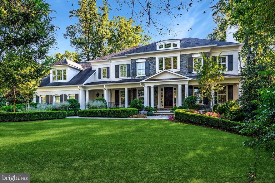 Featuring elegant design and thoughtfully curated spaces, this Langley Forest home is approximately 7100SF, gracefully sited on .95 Acre with several recent hardscape additions and an oversized 3 car garage. Quality finishes throughout include classic stone and painted brick front facade, a grand stair-hall entry, gorgeous, wide-plank oak hardwoods, ten foot ceilings, coffered ceilings in the family room and two masonry fireplaces with stone surrounds. Meticulously maintained and constructed with flawless integrity by BrickStone Homes, applying the finest treatments and materials. Expert craftsmanship is evident from every vantage.   The floorplan aptly partitions the home with two stair halls, one for formal entertaining and the other for practical everyday living. The grand two-story entry is flanked by formal living and dining rooms, with handsome glazed millwork that continues from space to space. Various rooms also lead to multiple porches and terraces along the first floor, and formal spaces are completed by a library and a powder room. The casual family space flows into a screened porch with coffered ceiling and patio access, and an oversized, bright yet intimate and comfortable great room with wet bar offers bucolic views of the expansive, flat yard with a fire pit and sport court.   The kitchen was designed by Lobkovitch Kitchens, and is generously outfitted with custom furniture grade cabinetry, oversized island with granite top, as well as professional grade appliances (Wolff, Subzero, Bosch, Miele) and an outdoor gas grilling area just adjacent to the kitchen.  A butler's pantry between the dining room and kitchen rounds out all pantry needs. Offsetting the kitchen is the perfectly proportioned mudroom with garage access and family stair hall.   The upper level houses an owner's suite that offers a sitting area, walk-in closet and plentiful sunlight, as well as a bathroom with dual furniture grade vanities and soaker tub. Secondary bedrooms repeat the theme of quality finishes, plentiful windows with pastoral views, and ensuite baths and walk-in closets.   A lower level completes the comfortable luxury lifestyle with incredible recreation space for effortless entertaining. Various features include custom built-ins, wet bar and masonry fireplace with stone surround.   There is a separate home theatre and private guest suite which includes a large bedroom and ensuite bath.   The exterior has been designed with the utmost discernment, executed to provide a private backyard retreat which features a stone patio with outdoor dining area and fire pit, sport court and an amply sized generator. The rear yard is lit and irrigated, and is surrounded by beautiful flowering, mature plantings and strategically chosen and placed trees and hedges.  The near acre lot provides the potential for many various additions such as a pool and perhaps even a pool house with yard still left over. Video Tour Link: https://vimeo.com/461419573