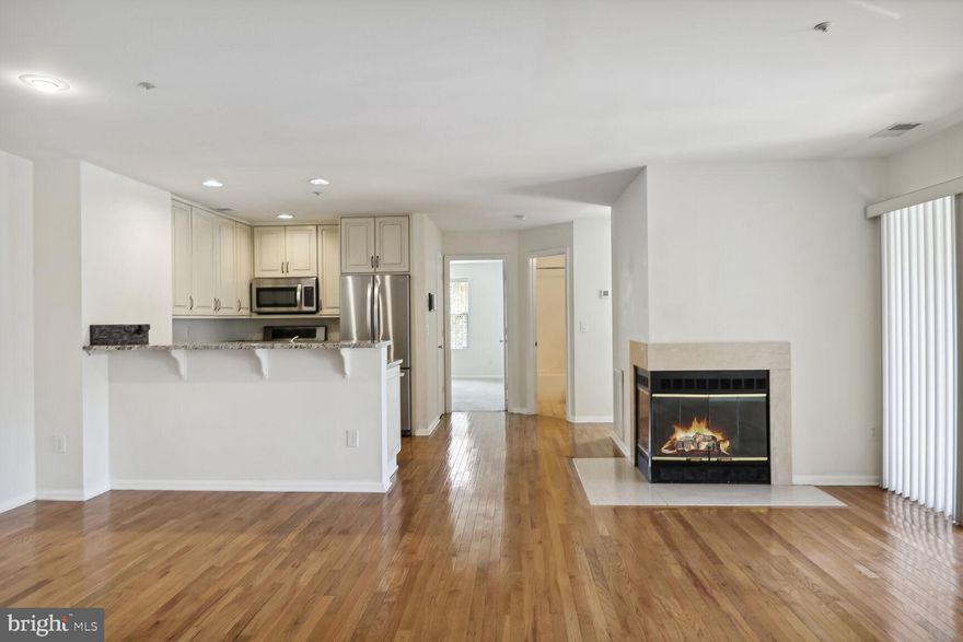 Welcome home!  Don't miss the opportunity to tour this bright, fully updated, open floor plan 1-level condo located just 5 minutes from Downtown Annapolis.  Upgrades include: hardwood flooring, granite counter tops, stainless steel appliances, private balcony, upgraded vanities in both bathrooms, walk in closet, reserved parking, professionally cleaned, close proximity to community pool, and more!  Priced to sell...call and schedule a showing today!