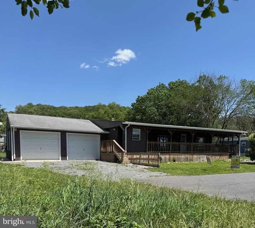 Ready to move in 3 bedroom, 2 bath house on a double lot.  New carpeting, flooring, paint, lots of upgrades.   Washer and dryer included.  Large front porch with storage on one end.  Double garage for storage and workbench.  Fenced back yard with large shed.