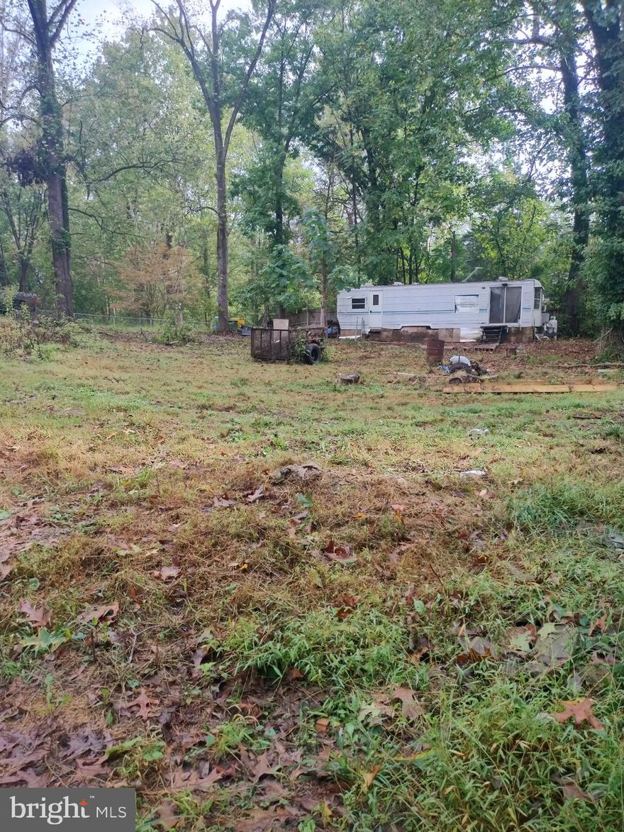 Very nice lot in a very desirable part of Harpers Ferry! Sits in campground but could be built on! Water available thru public well and has septic and electric! River access close by and camper included! Nice place to build or just for camping!