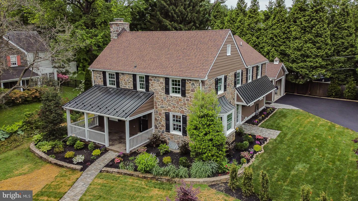 Welcome to 411 Wynmere Road located on the bustling hub of the main line. Do you like the quality of older construction when it meets modern living? Then this home is for you! This house was meticulously renovated with all the bells and whistles for today's buyers but keeping to the original charm and character of this Stone Colonial in mind. Features kept include the solid wood doors where possible, hardwood floors throughout and a big open-hearth fireplace. The list of new improvements is long and includes all new 200 amp electric service, featuring LED high-hats throughout, all new plumbing, (2) zone Bryant HVAC systems, Viwinco windows, french drain and any original walls that remained have received blown-in insulation.
Yet when you walk in the front door your eyes are drawn to todays modern style living. Featuring large open entryways to access all areas of the first floor. There is a full speaker system in the ceilings throughout the first floor, including the patio and front porch. A refined Chefs kitchen with KraftMaid cabinetry, level 6 solid Quartzite tops and stainless steel appliances including a double oven. One end of the kitchen opens to the family room featuring a gas fireplace with beautiful touches of shiplap and an exit to the slated patio for entertainment. A tasteful barn door separates the kitchen and mudroom with ample closet space, cubbies, powder room and access to the garage. This entryway and exit to the garage will keep loading and unloading to a breeze. Another side of the Kitchen has an exit to the newly sodded fenced in yard, perfect for a swing set to keep the little ones occupied while cooking and keeping an eye on things. The large fireside living room is a perfect setting for the Holiday times of the year with family, and a formal powder room complete this incredibly well planned-out first floor.
  There is an open stairway which leads to the full finished basement with bedroom including egress, full shower-stall bathroom and sitting room. Truly a teenagers dream..home gym/office or perfect for the nanny or in-law visits.
  The second floor includes 4 bedrooms. A Master Suite and 3 primary bedrooms, 2 Bedrooms sharing a Jack & Jill bath which includes a handheld shower for convenience. Then a separate bedroom/guest room including a private bath. The 4th bedroom on this floor is the master suite which has 2-double door closets in the main bedroom and a walk-in closet for the new master bathroom addition. This picturesque bathroom belongs in a magazine. Enjoy the soaking tub after a hard day at the office or the multi-function shower with body sprays for that spa-like routine in the morning. Also to help with those cold days in the winter there is a nice luxury of a thermostat heated floor. A hallway laundry and linen closet close out this well-designed second floor.
  Enjoy the tax break of a renovation versus New Construction. This home is only a few minutes walk to the train, downtown Narberth, parks, Restaurants, nite life and more. A few minutes drive to Suburban Square.. And to top it off… access to Center City is a breeze!! Make this property yours today!!! Check out the footprint of the property from the construction plans on the document above. Showings start Saturday morning and there is an Open House on Saturday 5/28 - @ 1 -4PM