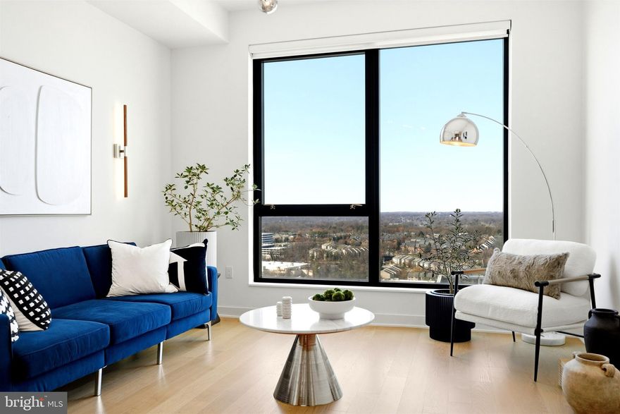 Now offered at a new price, this 1BR + den, 2-bath residence in a newer full-service high-rise in Tysons offers exceptional value just steps from The Boro, Metro, shopping, and dining.

Featuring 10-foot ceilings and floor-to-ceiling windows, the home is filled with natural light and sweeping skyline views. The open kitchen includes Italian cabinetry, a quartz waterfall island, and premium appliances. The spacious primary suite offers a custom walk-in closet and spa-inspired bath with upgraded Calcutta marble tile. A versatile den with adjacent full bath functions as a guest room, office, or flex space. In unit stacked washer & dryer included.

Enjoy resort-style amenities including 24-hour concierge, rooftop pool, fitness center with yoga studio, guest suite, pet spa, resident lounges, grilling areas, and secure garage parking.

One of the best values in The Boro, offering modern luxury and unmatched convenience.