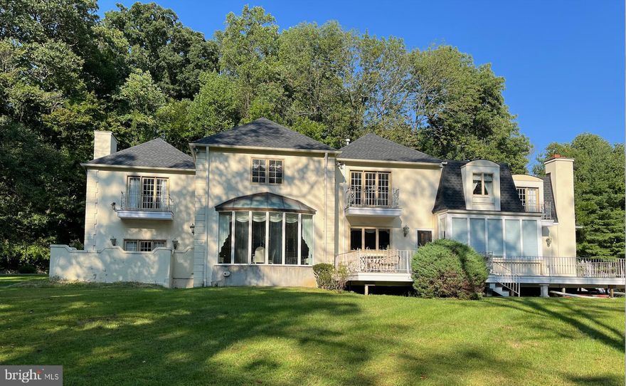 Original owner home for sale. This wonderfully modern bright open Pierce Kennedy home was designed for owner to comfortably house a large family. The home was placed on the lot to exemplify the southern exposure having a bright solarium bridging the kitchen and family room. The family room has a large stone wood burning fireplace and has a large deck overlooking the enclosed level yard. The foyer has a custom brass curved railed staircase that is highlighted by a glass domed ceiling. The entrance invites one to the dining room with floor to ceiling windows and enclosed patio that invites you for private dining and connection to the step down living room with fireplace. There are parquet and marble flooring throughout the first level. The upper level is fitted with a master suite with fireplace and dressing room. There are 3 more oversized bedrooms with ample baths and parquet wood floors on this level. The rear staircase takes you back to the first level. The oversized garages, large parking availability and walk out basement which includes a gym, full basement kitchen, and fireplace thus making this home especially easy living. The gated entry with in (on Roberts Road) and out (on South Ithan) driveway makes entertaining exceptionally simple!  Radnor schools and quick access to downtown Bryn Mawr, Amtrak and highways make this location ideal. All appointments through listing agent.