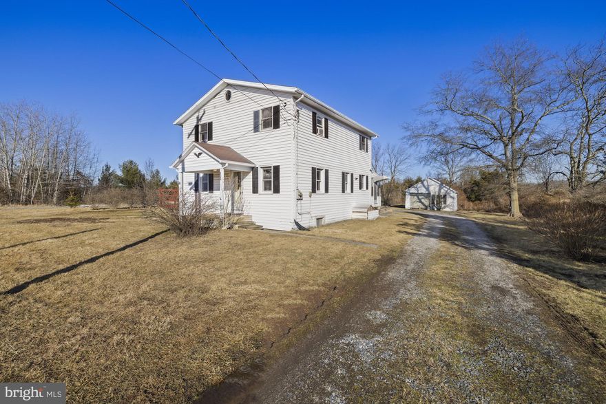 This 1,600 sq. ft. farmhouse sits on a 0.35-acre lot, offering the perfect balance of rural peace and potential. Featuring 4 bedrooms, including one on the main level, and 2 full bathrooms, this home provides plenty of space for family living. The upper-level laundry adds convenience, while the newer stainless steel 6-burner stove is a chef’s dream. Enjoy the outdoors on the deck or enclosed porch, perfect for relaxing and entertaining. The detached 1-car garage provides additional storage, and has a  full unfinished basement. Although the property requires renovation, it’s an excellent opportunity to restore and make this farmhouse your own. Don’t miss the chance to create your dream home in this serene setting!